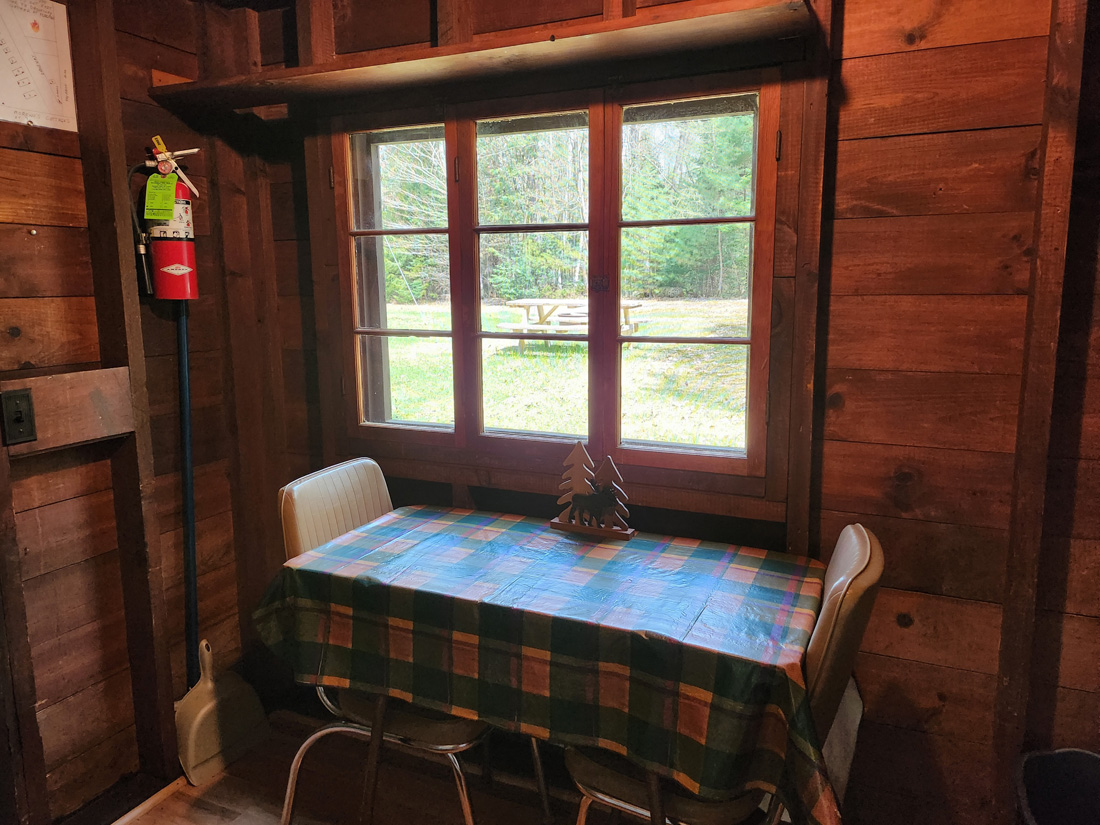 Small kitchen table with tablecloth