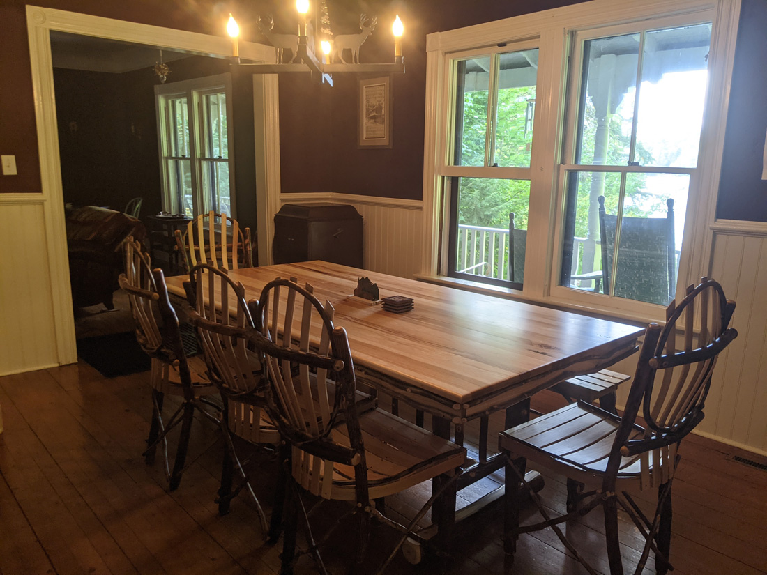 Dining room with wood chairs in rental house