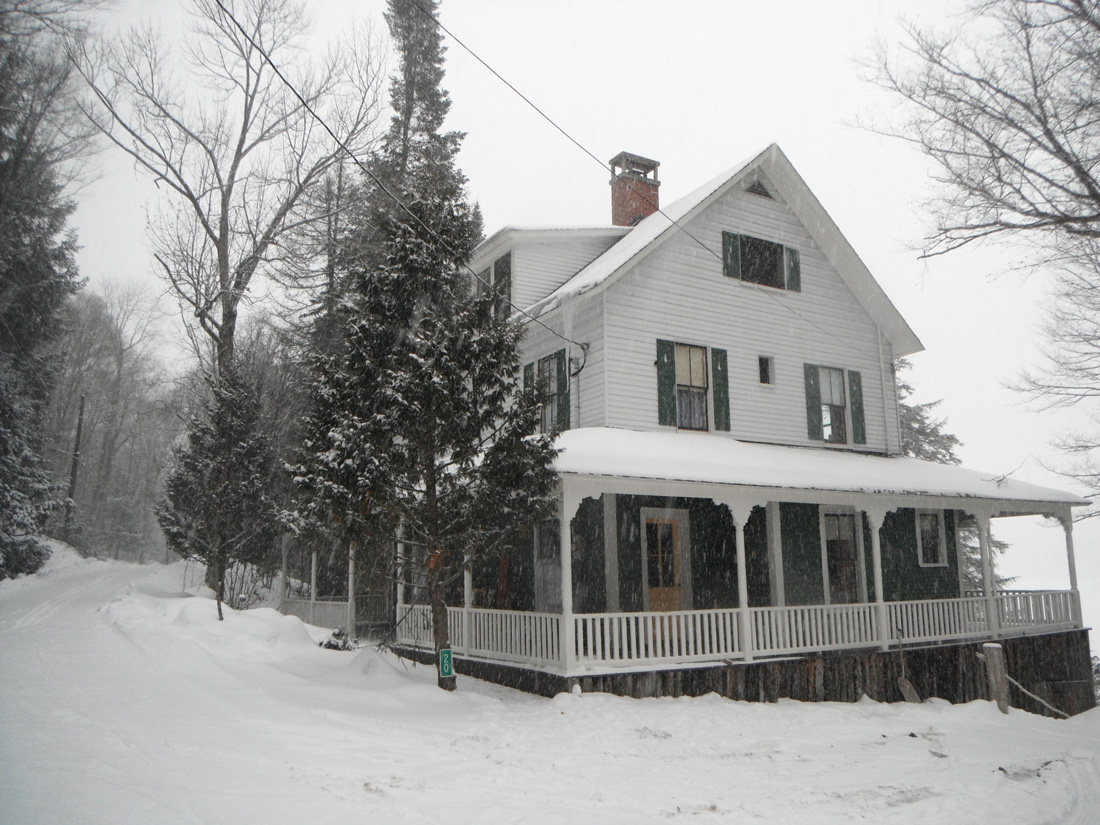 Winter scene exterior of white housr